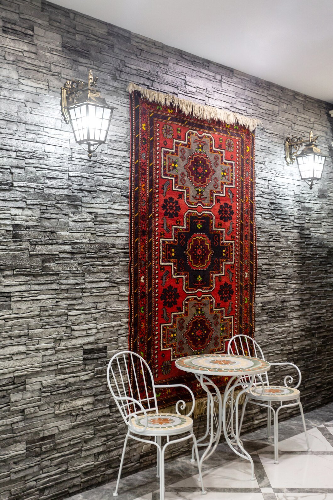 restaurant-hall-with-grey-stone-wall-decorated-with-azerbaijani-carpet_140725-8503.jpg